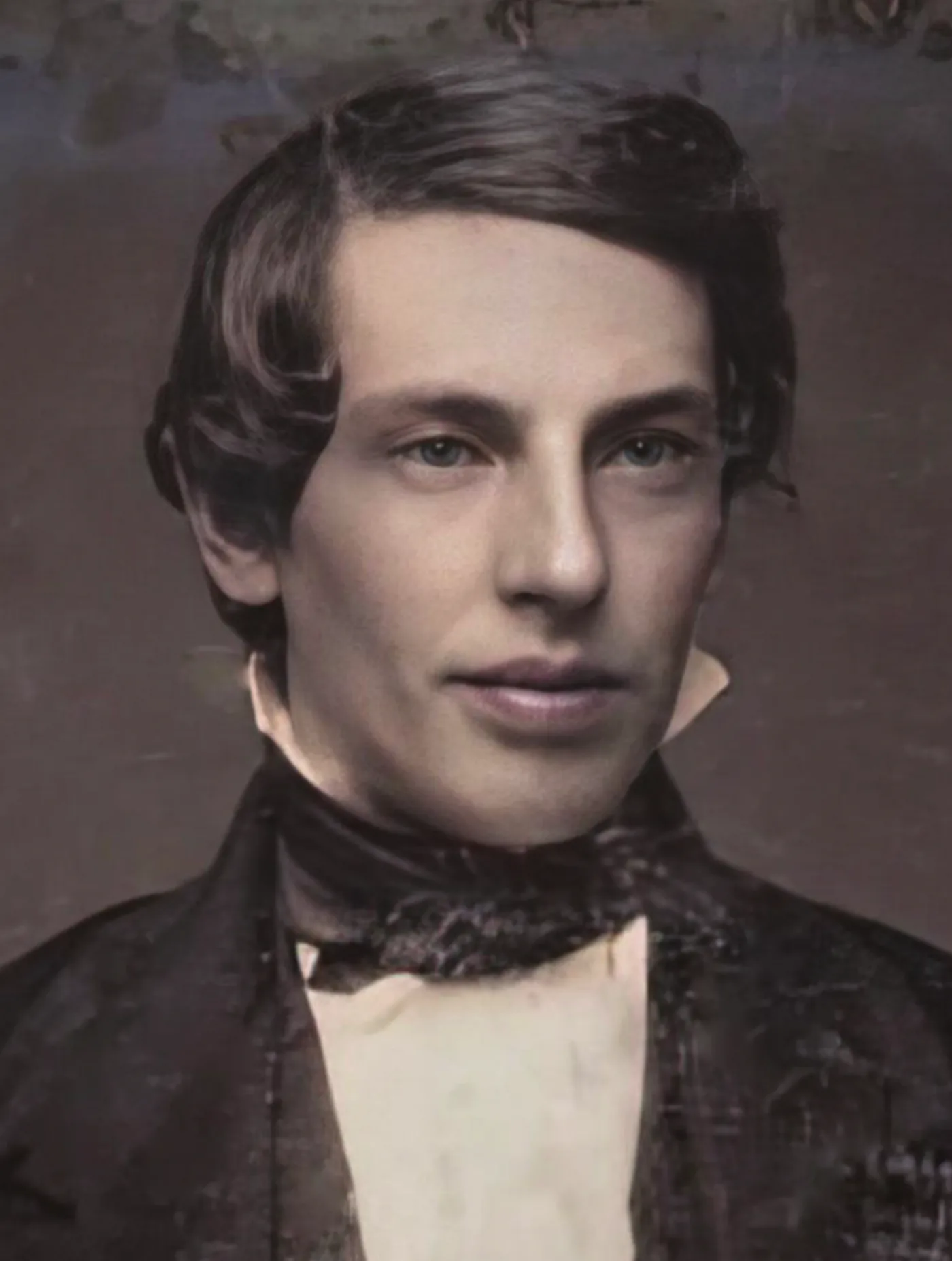 A daguerreotype portrait of Joseph Smith, in a dark coat and cravat, facing the camera.